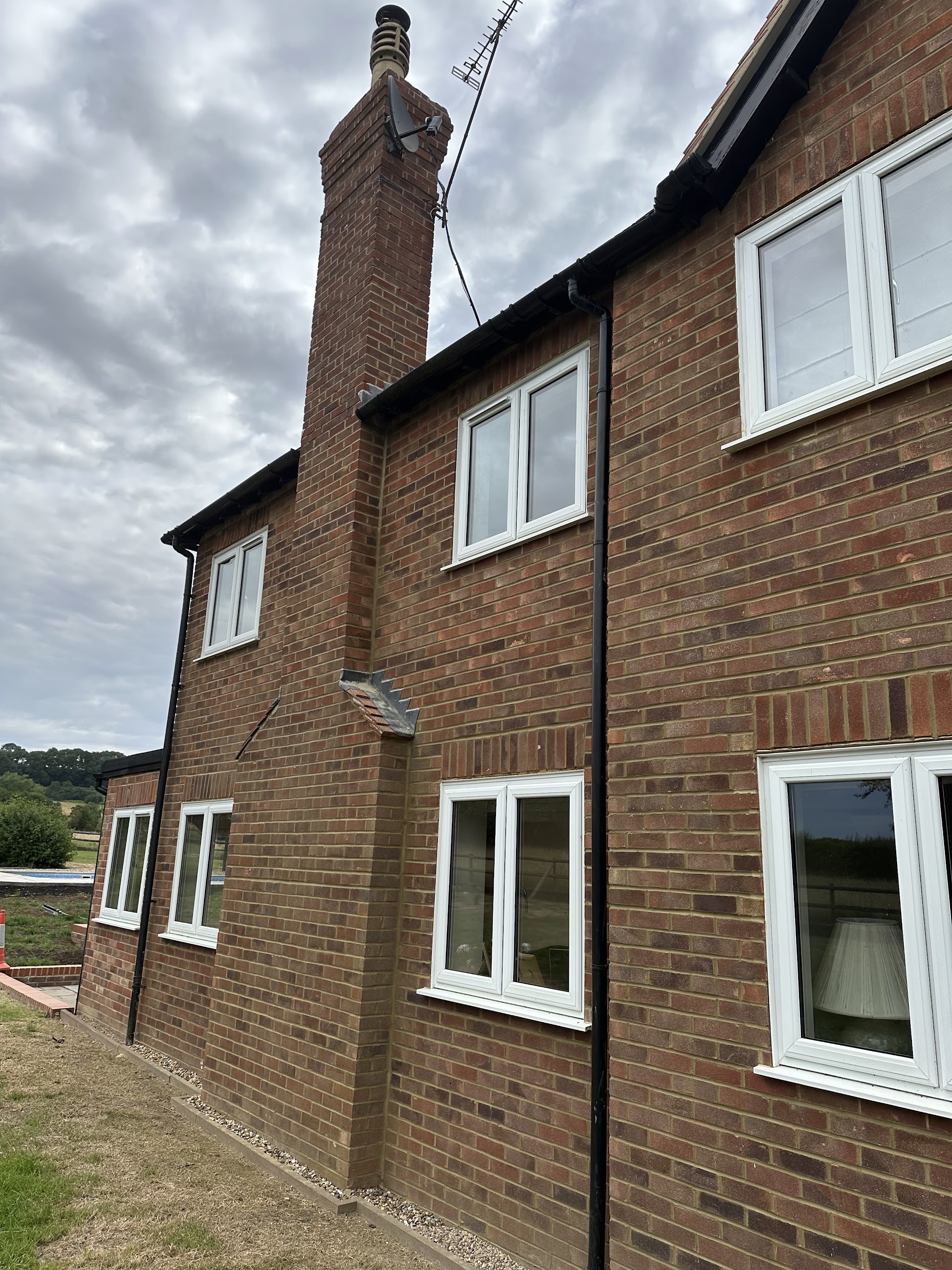Side elevation of a two storey brick house after repointing